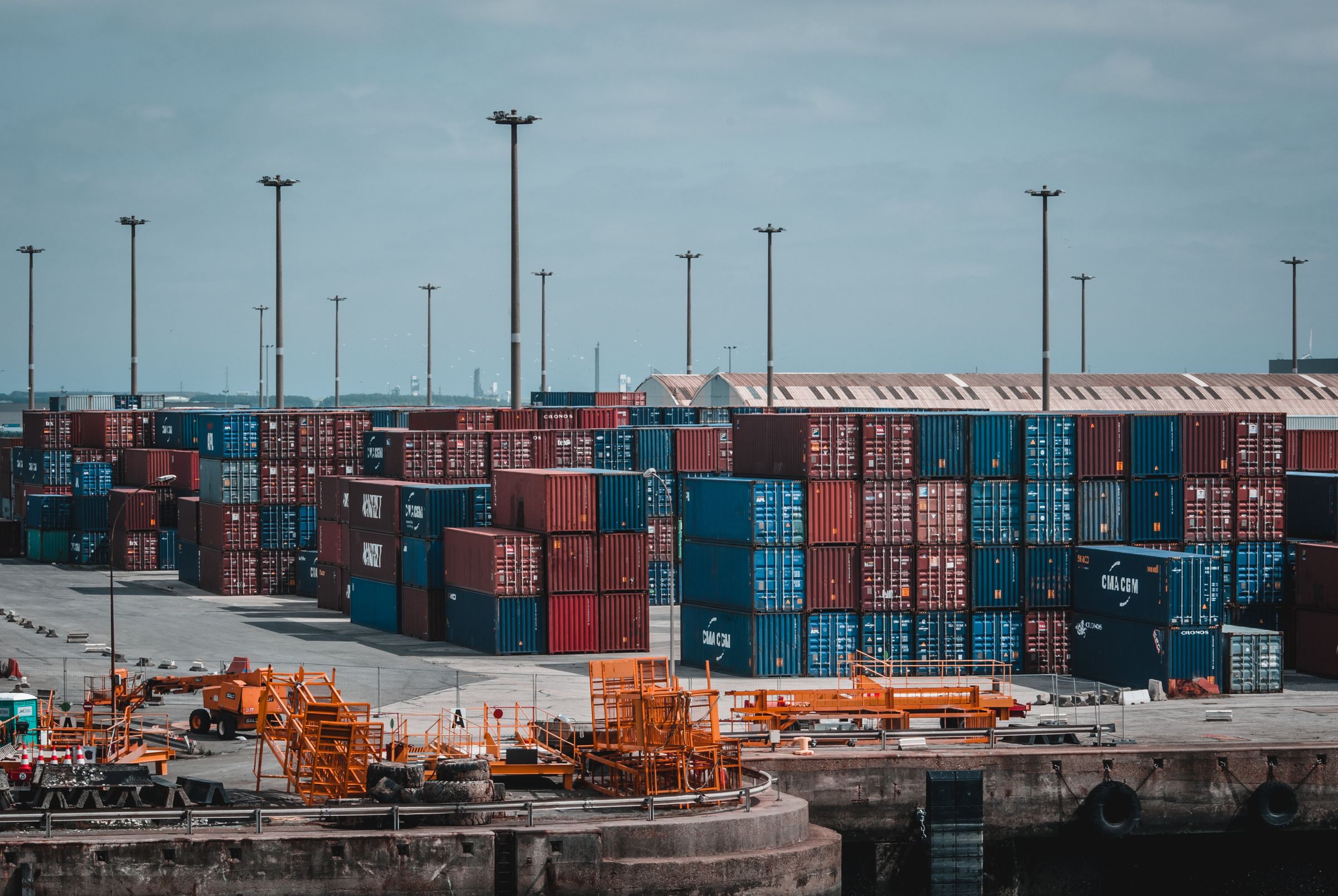 Freight containers and trucks in a yard
